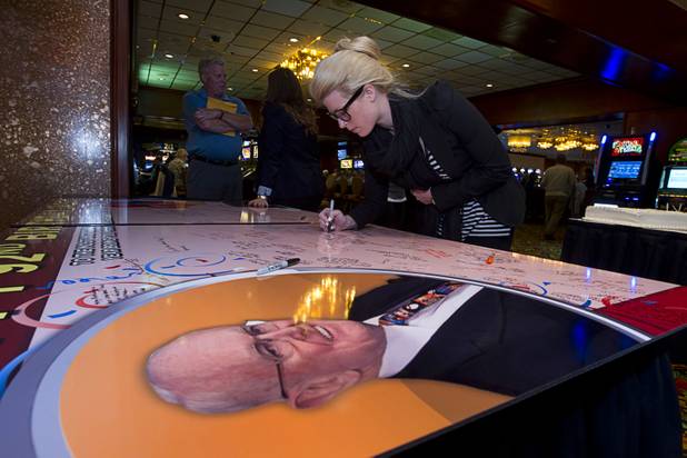 Katie Epstein, director of guest relations/vice president of the El Cortez, writes on a birthday card to Las Vegas gaming pioneer Jackie Gaughan during his 92nd birthday at El Cortez in downtown Las Vegas, Wednesday, Oct. 24, 2012.