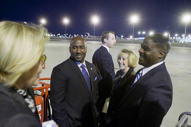 Local Democrats, from left, Nevada State Democratic chairwoman Roberta Lange, Las Vegas City Councilman Ricki Barlow, Clark County Commission Chairwoman Susan Brager and Kelvin Atkinson, candidate for State senate, wait to greet President Barack Obama at McCarran International Airport Wednesday, Oct. 24, 2012.