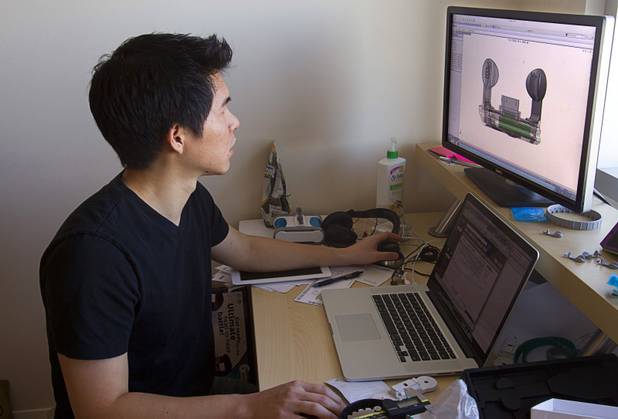 Ben Chen, a mechanical engineer, works on a docking prototype at the Romotive offices in downtown Las Vegas Wednesday, Oct. 24, 2012. The new Romo smartphone robot with enhanced features can be ordered on kickstarter.com and is featured in the Neiman Marcus Holiday catalog.