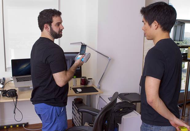 Roboticist Adam Setapen, left, talks with mechanical engineer Ben Chen talks in the Romotive "Software Cave" in downtown Las Vegas Wednesday, Oct. 24, 2012. The new Romo with enhanced features can be ordered on kickstarter.com and is featured in the Neiman Marcus Holiday catalog.