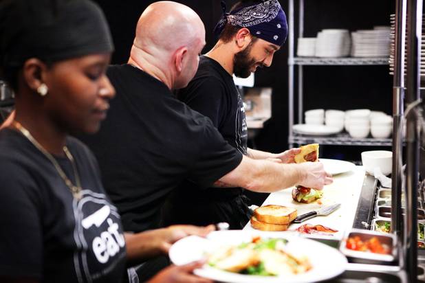 Cooks Courtney Armstrong, from left, Eric Long and Travis Silva serve up lunch at Eat restaurant in downtown Las Vegas on Wednesday, October 24, 2012.