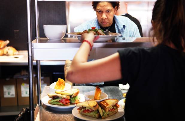 Eat restaurant owner Natalie Young plates lunches at her restaurant in downtown Las Vegas on Wednesday, October 24, 2012.