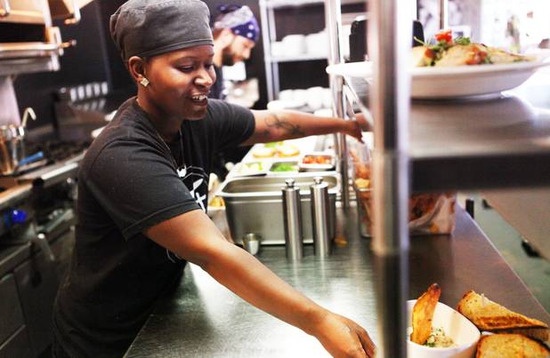 Line cook Courtney Armstrong serves up lunch at Eat restaurant in downtown Las Vegas on Wednesday, October 24, 2012.