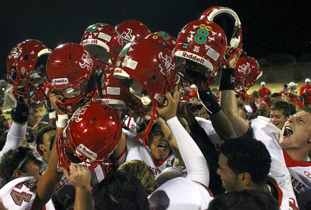 Arbor View High School players celebrate after defeating Palo Verde 35-29 at Palo Verde High School Thursday, Oct. 25, 2012.