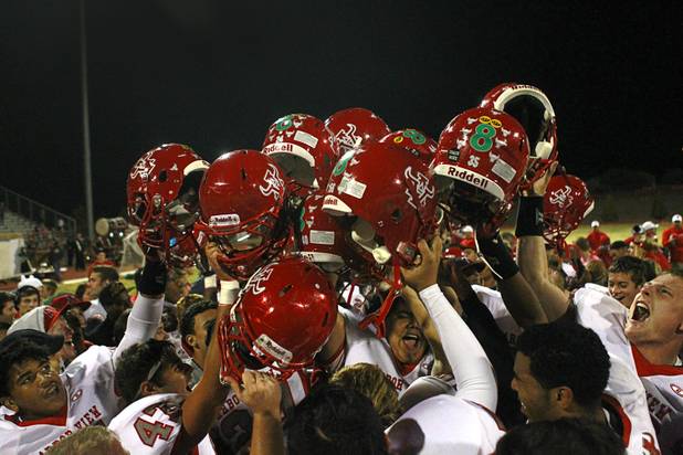 Arbor View High School players celebrate after defeating Palo Verde 35-29 at Palo Verde High School Thursday, Oct. 25, 2012. 