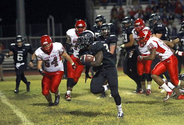 Palo Verde's Lee Griggs carries the ball during a touch down run against Arbor View Thursday, Oct. 25, 2012. Arbor View beat Palo Verde 35-29.