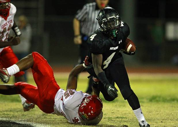 Arbor View's Jordan Eggleston makes a diving tackle on Palo Verde's Lee Griggs Thursday, Oct. 25, 2012. Arbor View beat Palo Verde 35-29.