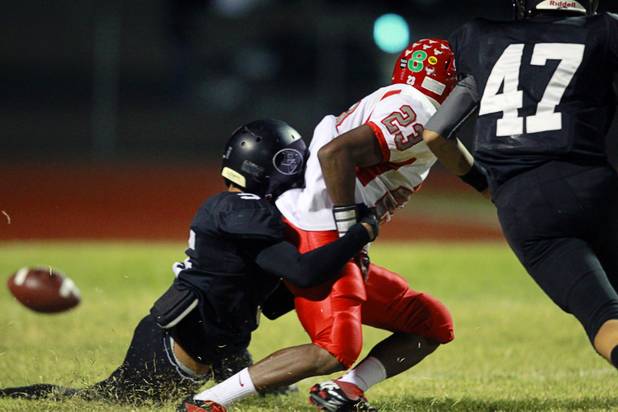 Palo Verde's Devin Finn causes Arbor View's Salah Boyce to fumble the ball Thursday, Oct. 25, 2012. Arbor View recovered the ball in their own end zone for a touch back. Arbor View beat Palo Verde 35-29.