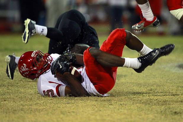 Arbor View's Jacob Parker comes down with the ball after making an interception in the third quarter of Arbor View's game against Palo Verde Thursday, Oct. 25, 2012. Arbor View beat Palo Verde 35-29.
