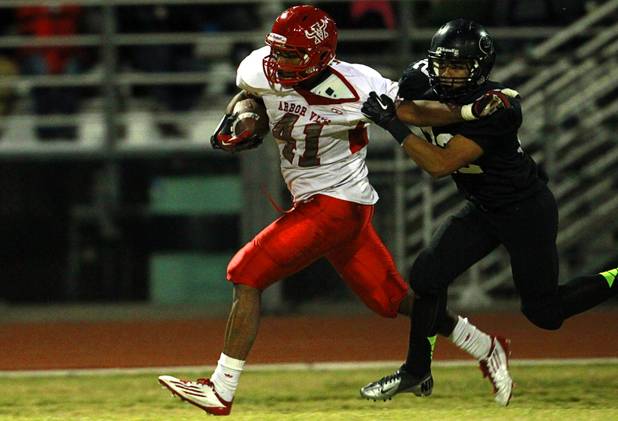 Arbor View's Rasheed Parks is tackled by Palo Verde's Calvin Beaulieu Thursday, Oct. 25, 2012. Arbor View beat Palo Verde 35-29.