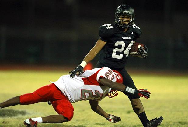 Arbor View's Salah Boyce makes a tackle on Palo Verde's Ryan Beaulieu Thursday, Oct. 25, 2012. Arbor View beat Palo Verde 35-29.