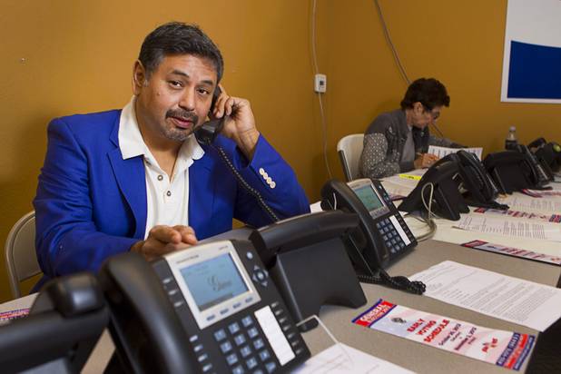Mitt Romney supporter Carlos Rossi makes calls at the Mitt Romney for President Headquarters Thursday, Oct. 25, 2012.