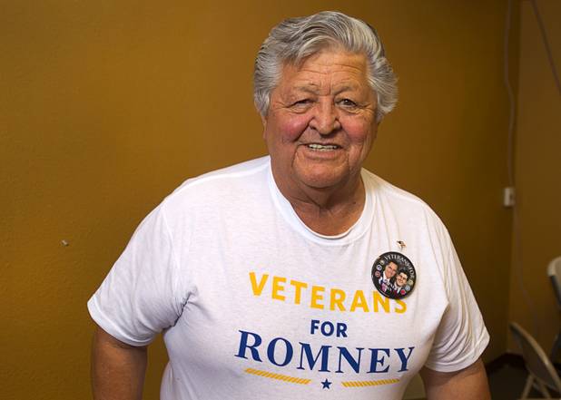 Mitt Romney supporter Nash Torres poses at the Mitt Romney for President Headquarters Thursday, Oct. 25, 2012.