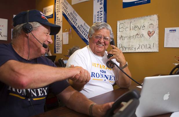 Mitt Romney supporter Nash Torres, center, makes calls at the Mitt Romney for President Headquarters Thursday, Oct. 25, 2012. Paul Martin is at left.