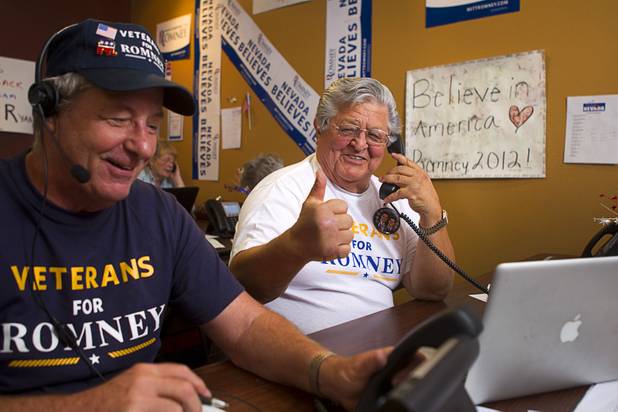 Mitt Romney supporter Nash Torres, center, makes calls at the Mitt Romney for President Headquarters Thursday, Oct. 25, 2012. Paul Martin is at left.