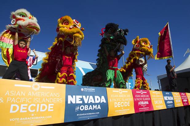 Lion dancers perform during an Asian American and Pacific Islander early voting rally for President Obama at the Chinatown Mall on Saturday, Oct. 27, 2012.