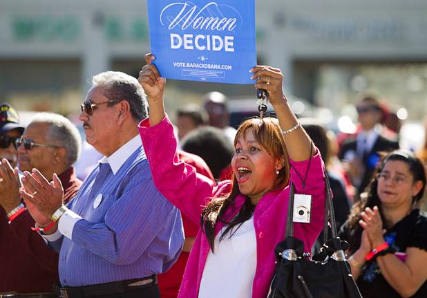 Elizabeth Rufus holds up a sign during an Asian American and Pacific Islander early voting rally for President Obama at the Chinatown Mall on Saturday, Oct. 27, 2012.