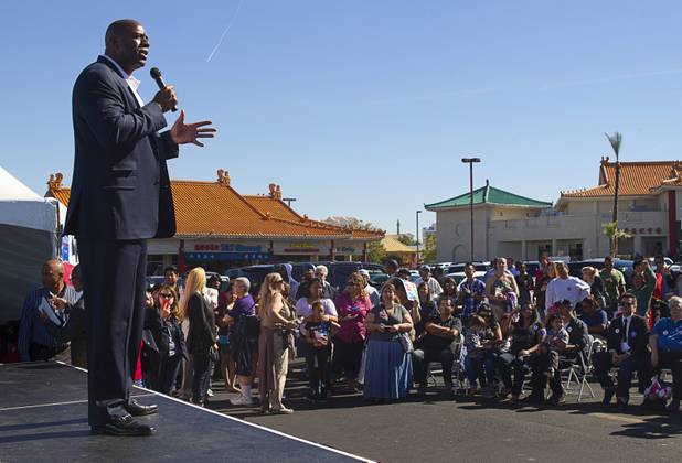 Basketball legend Earvin "Magic" Johnson campaigns for President Obama during an Asian American and Pacific Islander early voting rally at the Chinatown Mall on Saturday, Oct. 27, 2012.