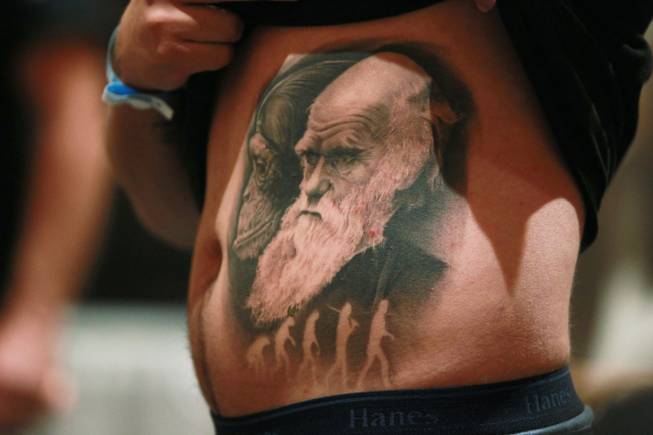 A man shows off his evolution themed tattoo at Mario Barth's Biggest Tattoo Show On Earth at the Mirage Saturday, Oct. 27, 2012.