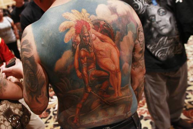 A man displays his back tattoo depicting an Aztec legend similar to Romeo and Juliet at Mario Barth's Biggest Tattoo Show On Earth at the Mirage Saturday, Oct. 27, 2012.