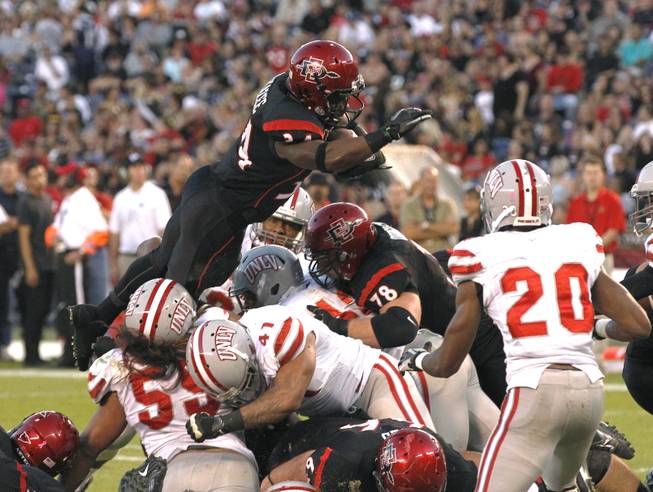 San Diego State's Walter Kazee goes over the top for a 1-yard touchdown against UNLV during an NCAA college football game Saturday, Oct. 27, 2012, in San Diego.