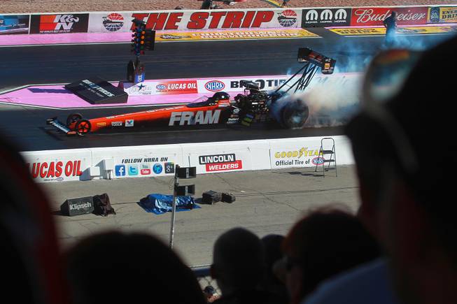 Top fuel racer Spencer Massey smokes his tires during the 12th Annual Big O Tires Nationals NHRA drag race on The Strip at Las Vegas Motor Speedway Sunday, Oct. 28, 2012.