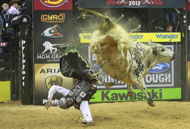 Jordan Hupp of Cheyenne, Wyo., gets thrown from a bull during the Professional Bull Riders Built Ford Tough Series World Finals at the Thomas & Mack Center on Sunday, Oct. 28, 2012.