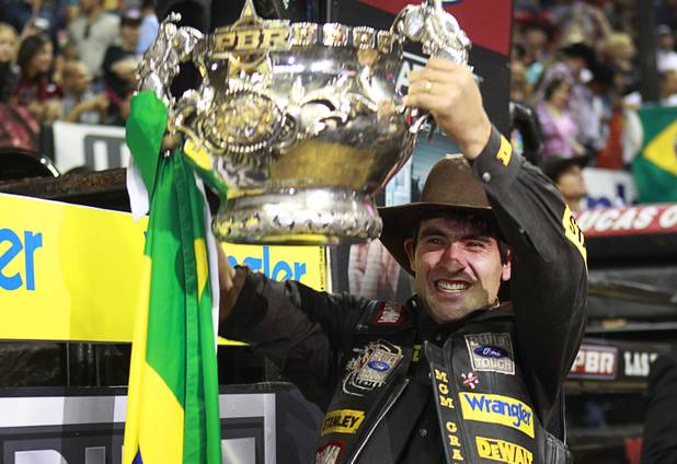 Brazilian bull rider Silvano Alves celebrates with his trophy after winning the series championship during the Built Ford Tough Series Professional Bull Riders (PBR) World Finals at the Thomas & Mack Center Sunday, Oct. 28, 2012. Alves is the first rider to win back-to-back series championships in PBR.