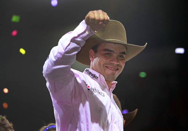Brazilian bull rider Emilio Resende celebrates after being named Rookie of the Year during the Built Ford Tough Series Professional Bull Riders (PBR) World Finals at the Thomas & Mack Center Sunday, Oct. 28, 2012.