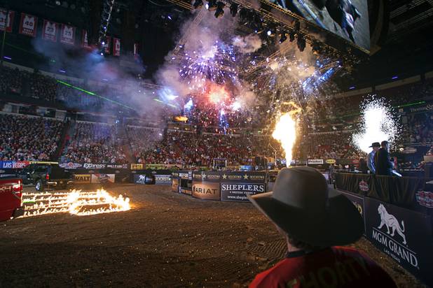 Fireworks explode at the start of the Built Ford Tough Series Professional Bull Riders (PBR) World Finals at the Thomas & Mack Center Sunday, Oct. 28, 2012. 