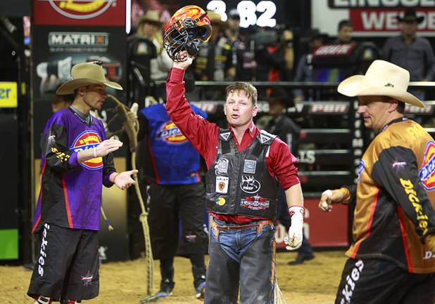 Chris Shivers, center, of Jonesville, La. acknowledges the crowd after a ride during the Built Ford Tough Series Professional Bull Riders (PBR) World Finals at the Thomas & Mack Center Sunday, Oct. 28, 2012. Shivers retired Sunday after making a PBR-record 15th World Finals appearance.