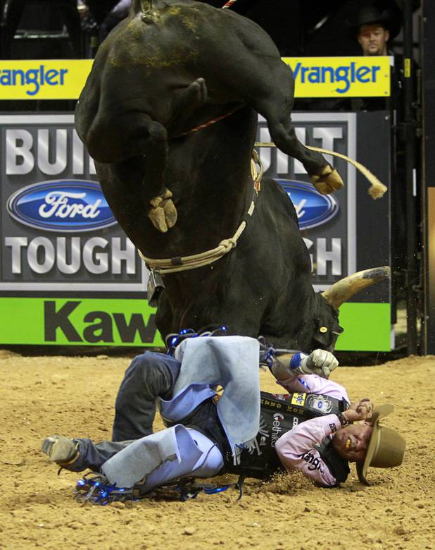 Emilio Resende covers up during the Built Ford Tough Series Professional Bull Riders (PBR) World Finals at the Thomas & Mack Center Sunday, Oct. 28, 2012. Resende was named Rookie of the Year.