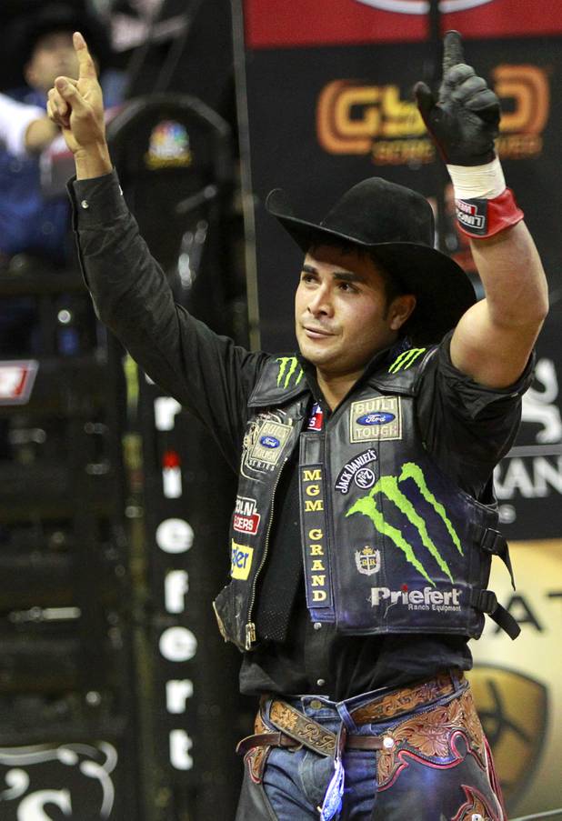 Brazilian bull riders Robson Palmero celebrates his final ride during the Built Ford Tough Series Professional Bull Riders (PBR) World Finals at the Thomas & Mack Center Sunday, Oct. 28, 2012. Palermo finished first in the Las Vegas event. Brazilian Silvano Alves won the series title.