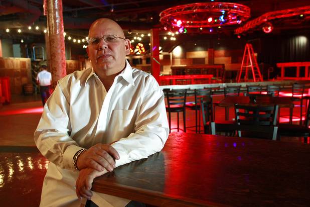 Owner Stoney Gray sits for a photo at Stoney's Rockin' Country's new location in Town Square Tuesday, Oct. 30, 2012.
