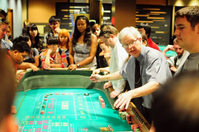 UNLV gaming professor Gary Waters explains the table game of craps to hotel college students at the Konami Gaming Lab on Tuesday, Oct. 30, 2012. The gaming lab gives students hands-on experience in casino management.