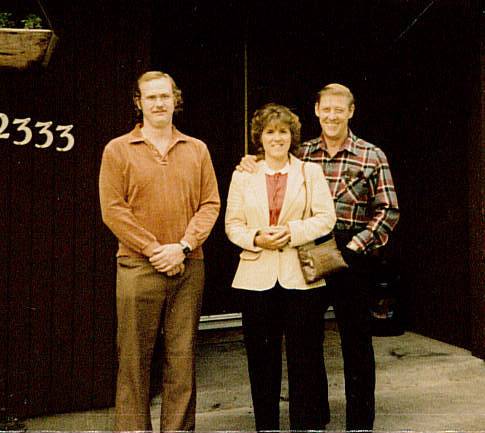 John E. Feathers, left, died in February, leaving behind a vast collection of maps in his home. His stepmother, Joyce Feathers, center, and father, John Feathers, say their son was fond of travel. This picture, taken in 1983, was provided by John Feathers.