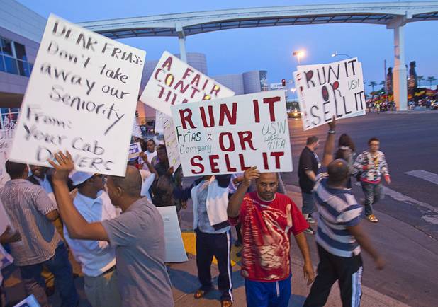 Cab drivers hold an informational picket at the intersection of Convention Center Drive and Paradise Road in front of the Las Vegas Convention Center Wednesday, October 31, 2012. The drivers' unions are in a contract dispute with Frias Transportation and disagree with proposed changes in the companys seniority policies. They also say the company does not pay drivers fair wages.