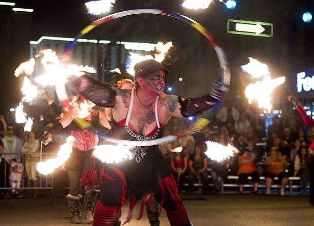 A Flameology dancer performs during third annual Halloween Parade in downtown Las Vegas Wednesday, October 31, 2012.