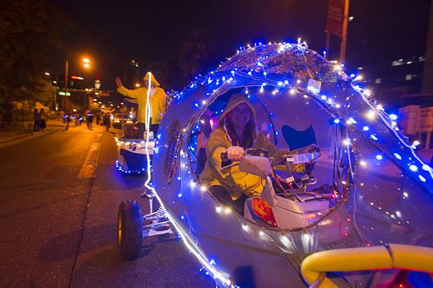 Tina Medina rides in the "Dustiest Catch" vehicle during third annual Halloween Parade in downtown Las Vegas Wednesday, October 31, 2012.