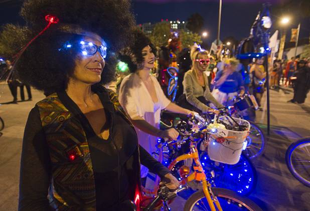 Cyclists, including Wanda Kefalas, left, prepare to ride in the third annual Halloween Parade in downtown Las Vegas Wednesday, October 31, 2012.
