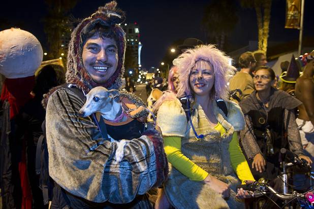 Levi Smith holds "Deer," a 14-year-old Italian Greyhound as he prepares to march in the third annual Halloween Parade  in downtown Las Vegas Wednesday, October 31, 2012. His wife Jacqueline Berry looks on at right.