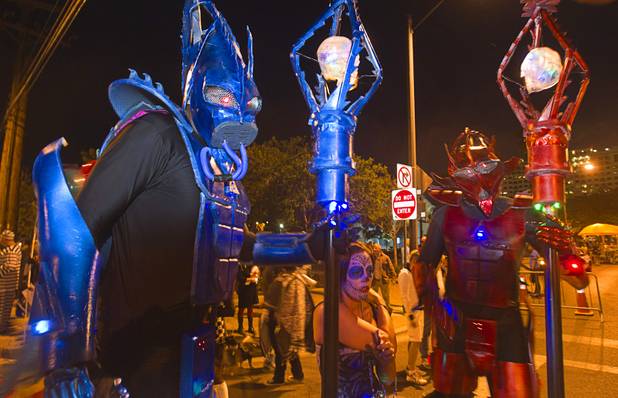 Martiona headhunters Joseph Reif, left, and Jose Hidalgo wait for the start of the third annual Halloween Parade  in downtown Las Vegas Wednesday, October 31, 2012.
