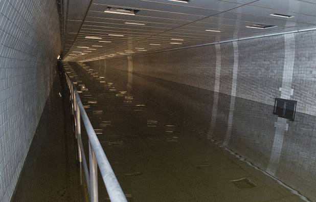 In a photo made available by the Metropolitan Transportation Authority on Tuesday, Oct. 30, 2012 water floods the Hugh L. Carey Tunnel, formerly known as the Brooklyn Battery Tunnel during superstorm Sandy, in New York. Nearly 4,000 feet of the Brooklyn-Battery Tunnel remained heavily flooded Tuesday morning. (AP Photo/Metropolitan Transportation Authority, Patrick Cashin)