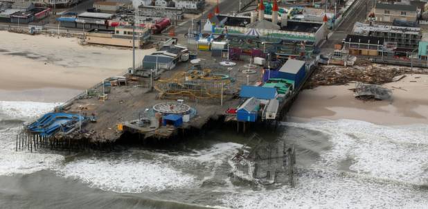 The aerial view shows storm damage over the Atlantic Coast in Seaside Heights, N.J.,  Wednesday, Oct. 31, 2012, taken from a helicopter traveling behind the helicopter carrying President Obama and New Jersey Gov. Chris Christie, as they viewed storm damage from superstorm Sandy.   (AP Photo/Doug Mills, The New York Times, Pool)