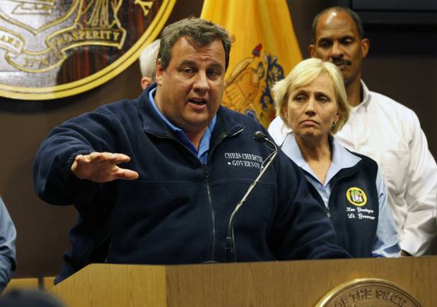 As New Jersey Lt. Gov. Kim Guadagno and Edward Dickson, Director New Jersey Office of Homeland Security and Preparedness look on Tuesday, Oct. 30, 2012, in Ewing, N.J., Gov. Chris Christie describes the devastation he saw earlier on a tour of areas hit hard by Sandy. Christie warned that the recovery would be long for a state that got the brunt of the storm and said that some parts of the shore  a cherished spot for many of the state's residents and an economic engine as a major part of New Jersey's $35.5 billion tourism industry  might never look the same. (AP Photo/Mel Evans)