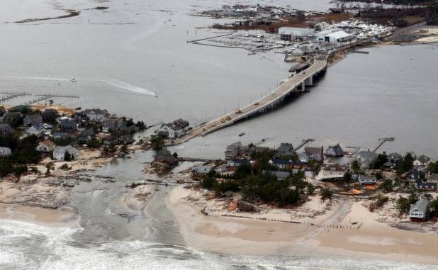 The aerial view shows storm damage over the Atlantic Coast in Seaside Heights, N.J.,  Wednesday, Oct. 31, 2012, taken from a helicopter traveling behind the helicopter carrying President Obama and New Jersey Gov. Chris Christie, as they viewed storm damage from superstorm Sandy.   (AP Photo/Doug Mills, The New York Times, Pool)