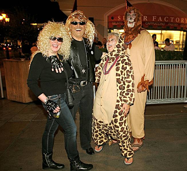 Janice Wallman, from left, Bruce Wall, Karen Libonati and Mike Libonati, of Vancouver, British Columbia,  said they’ve been planning their costumes for their Vegas Halloween visit since July. Oct. 31, 2012.