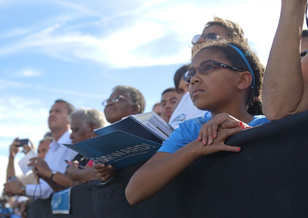MacKenzie Hinds, 11, listens to President Barack Obama during a campaign rally at the Cheyenne Sports Complex near the College of Southern Nevada in North Las Vegas Thursday, Nov. 1, 2012.