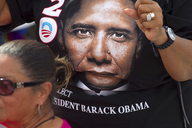 A woman wears a T-shirt with the image of President Barack Obama during a campaign rally at the Cheyenne Sports Complex near the College of Southern Nevada in North Las Vegas Thursday, Nov. 1, 2012.