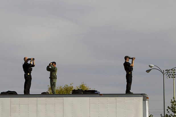 A security team keeps an eye out as they wait for President Barack Obama to arrive at a campaign rally at the Cheyenne Sports Complex near the College of Southern Nevada in North Las Vegas Thursday, Nov. 1, 2012.